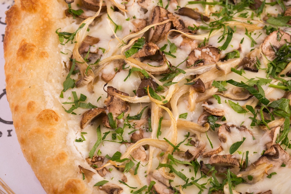 Piece Of Mushroom Pizza With Cepes Oyster Mushrooms And Champignons