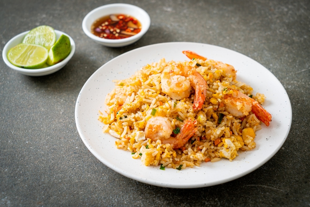 A view of a plate of fried rice with shrimps