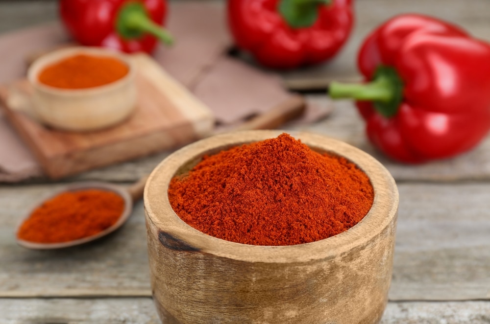 A view of paprika inside a wooden bowl