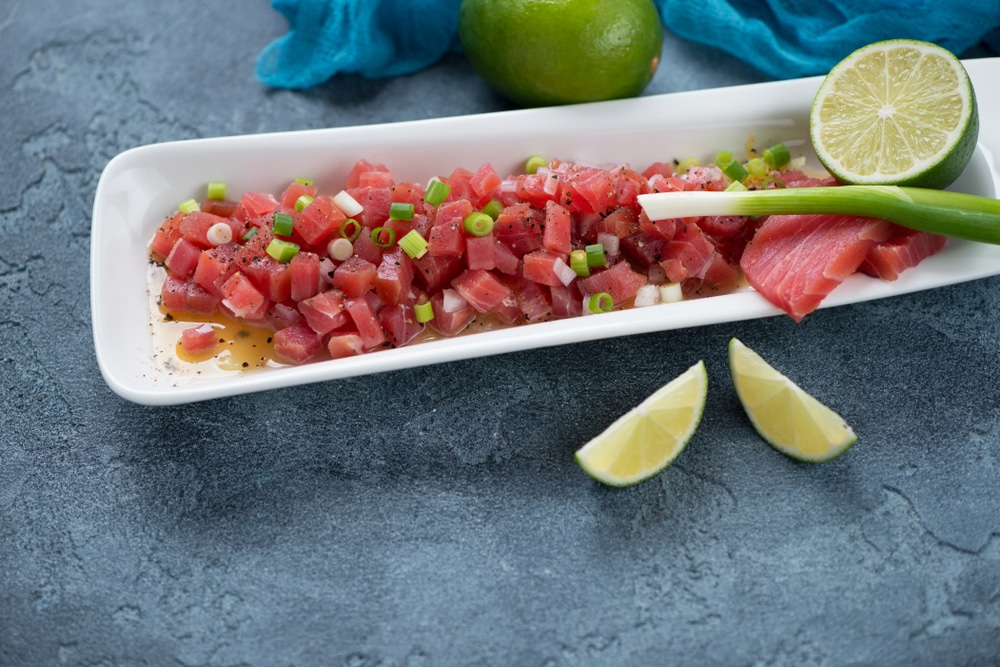 Tuna ceviche served in a white long plate