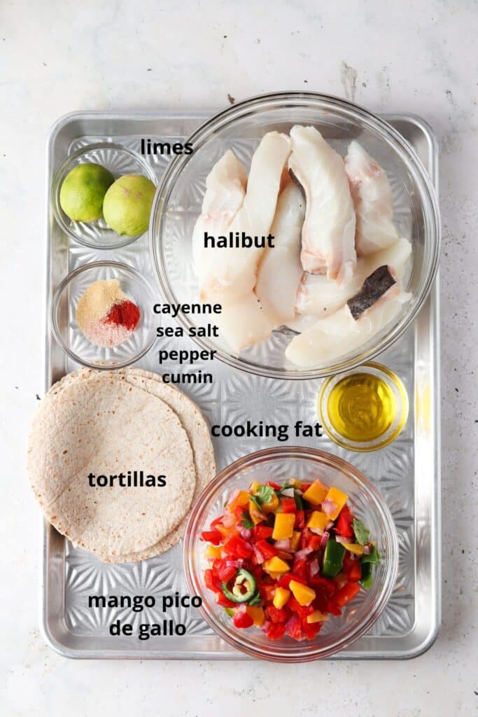 ingredients for cooking halibut tacos with oil halibut fillets limes seasonings tortillas