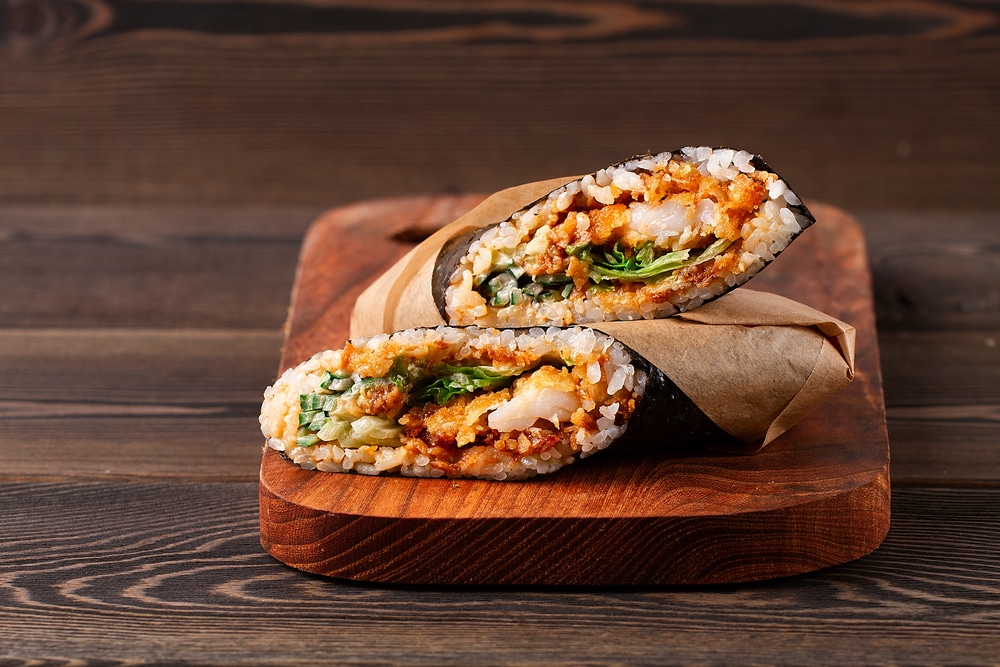 Sushi burrito on a wooden tray 