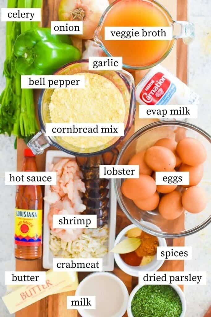 ingredients for swafood dressing eggs spices parsley crabmeat milk butter garlic and broth in different bowls