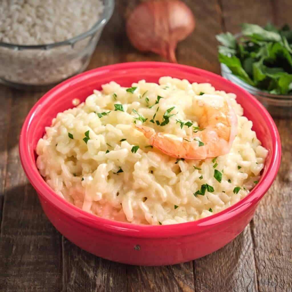 shrimp risotto in a pink bowl