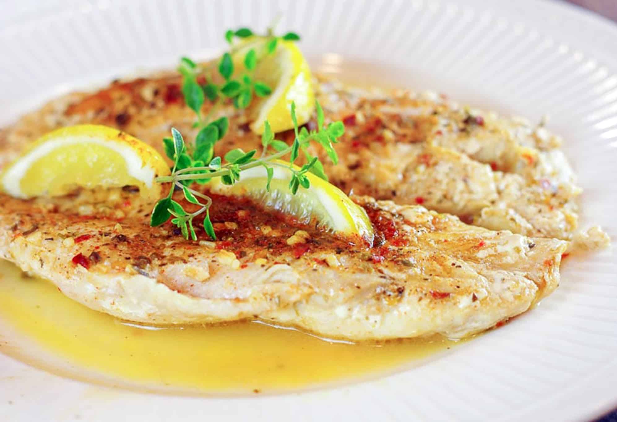 Grilled Grouper with Lemon and Herbs served in a plate