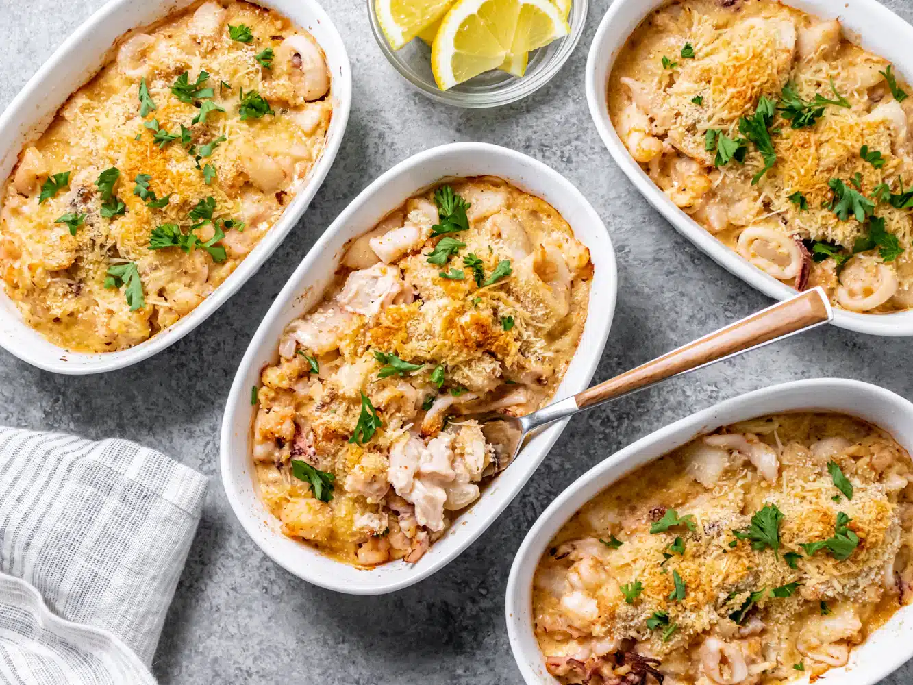 baked Seafood Casserole with Scallops and Crab Meat in dishes