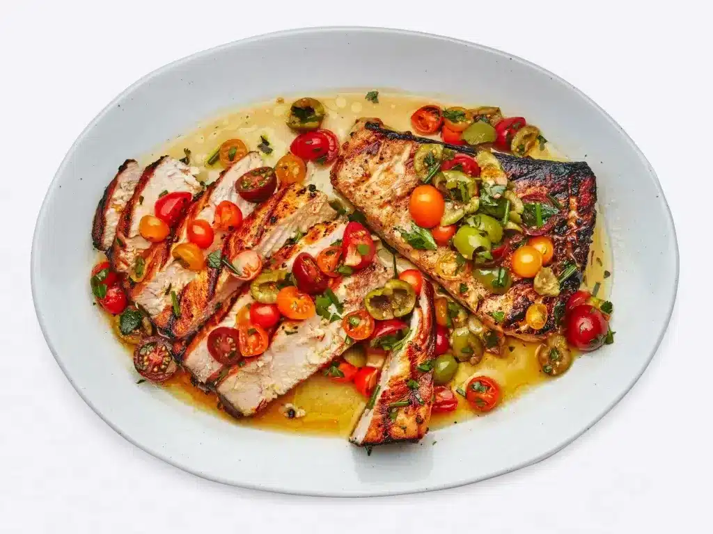 grilled Swordfish garnish with baby tomatoes and green chillies