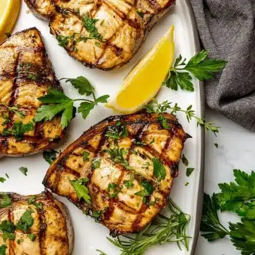 grilled Swordfish served with lemon wedges