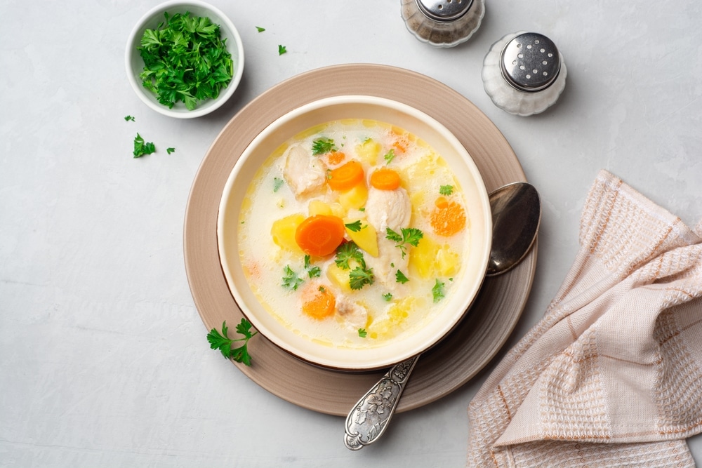 Creamy Fish Chowder Soup In Bowl On Concrete Background Top