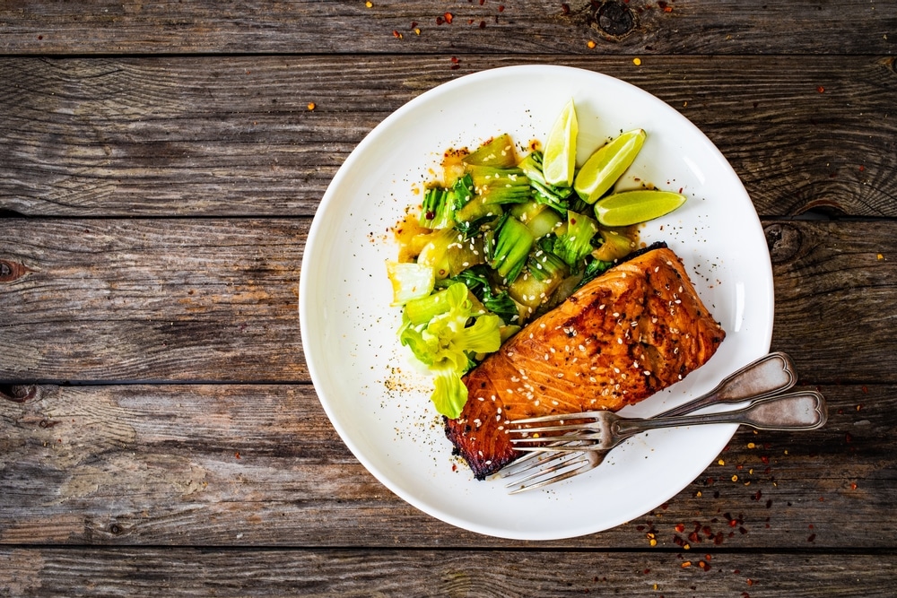 Fried coho Salmon Steak With Pak Choi And Lime On