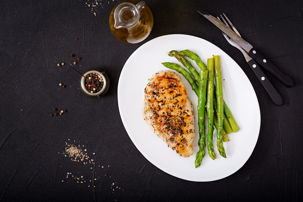 Chicken Fillet Cooked On A Grill And Garnish Of Asparagus