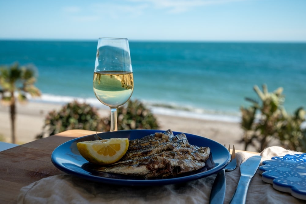 Sardines Espeto Prepared On Skewers And Open Flame On Fireplace