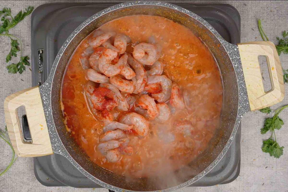 shrimps in masala curry in a pan shrimps in masala curry in a pan