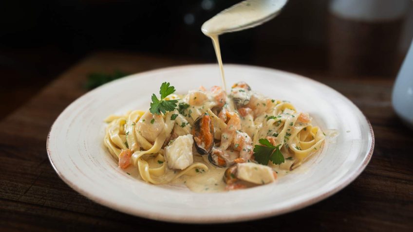 creamy seafood pasta in a plate creamy seafood pasta in a plate
